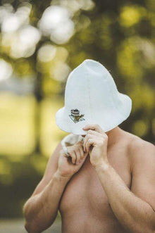Wool sauna hat with a hot tub picture, white